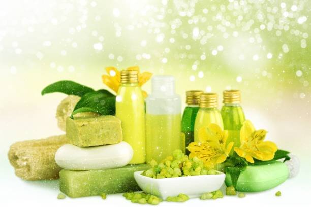 Bottles with organic essential aroma oils on background